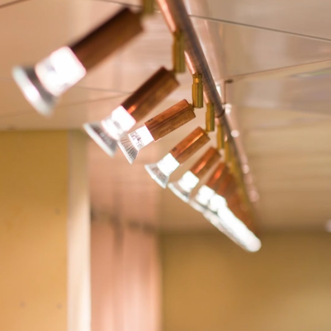 Star 6 ceiling light by Jonas Bohlin | Hard-wired | Rough copper | W200cm x H22cm | LED bulbs included